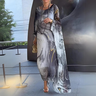 Lange elegante jurk met wijde mouwen en sierlijk patroon