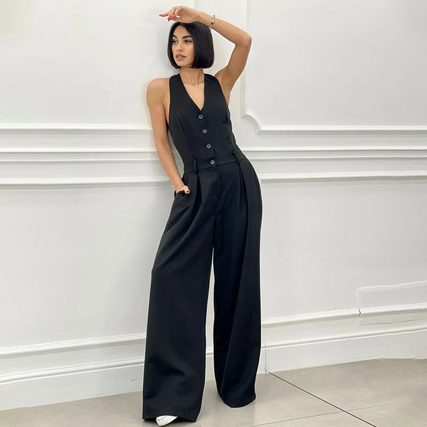 Mouwloze dames jumpsuit met halternek wijde pijpen en knopen aan de voorkant