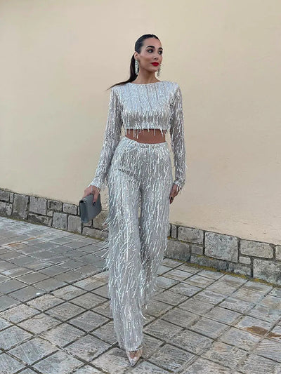 Glinsterende avondset met cropped top en lange mouwen broek voor een opvallende look