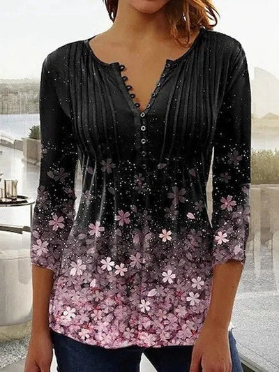 Elegante blouse met knopen en geborduurde bloemen op de voorkant