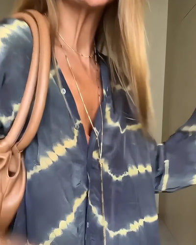 Lange boho jurk met knopen en elegante uitstraling