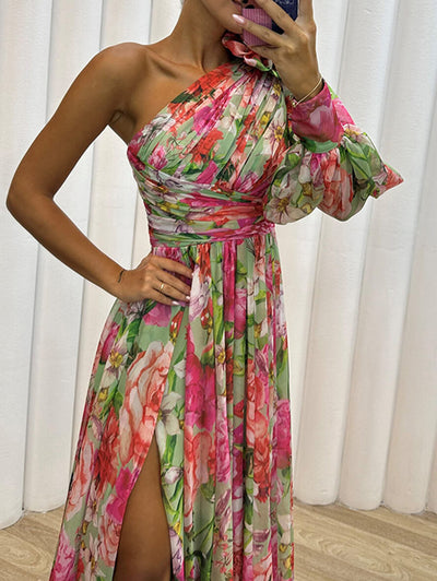 Elegante lange jurk met bloemenprint en één lange wijde mouw