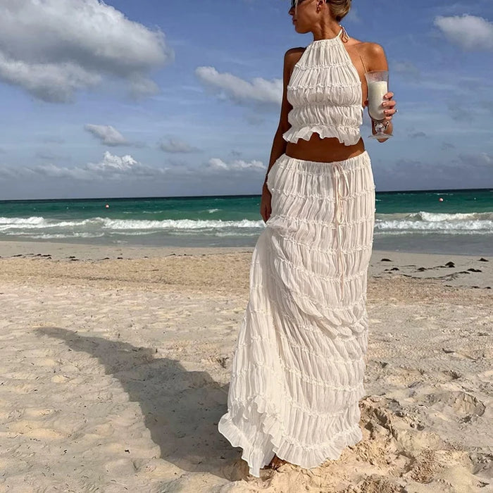 Tweeledig zomersetje met haltertop en lange rok met open detail