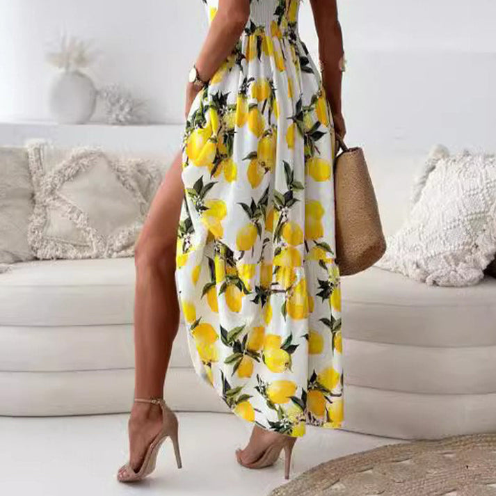 Maxi zomerjurk met fruitprint en elegante uitsnijding