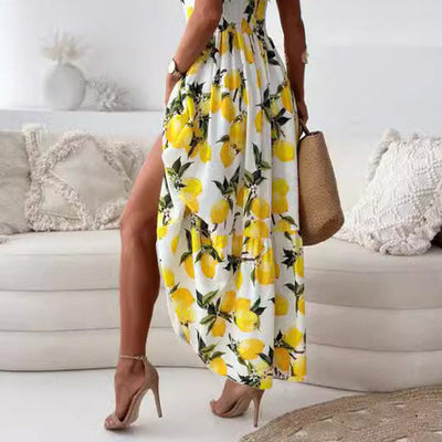 Maxi zomerjurk met fruitprint en elegante uitsnijding