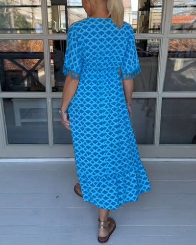 Luchtige maxi jurk met V-hals en speels patroon voor een relaxte stijl