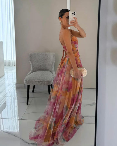 Elegante maxi jurk met dunne bandjes en artistiek bloemenmotief