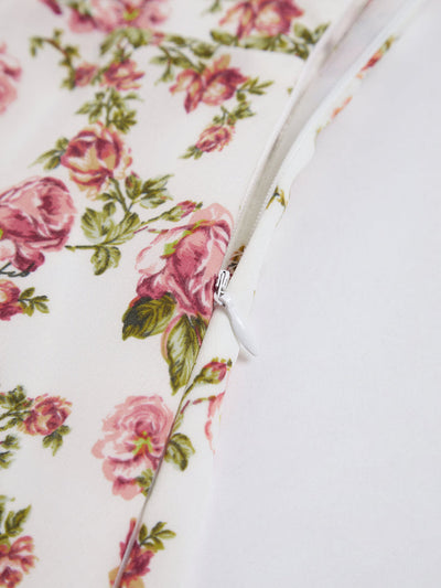 Zomerse midi jurk met bloemenpatroon en fijne schouderbandjes