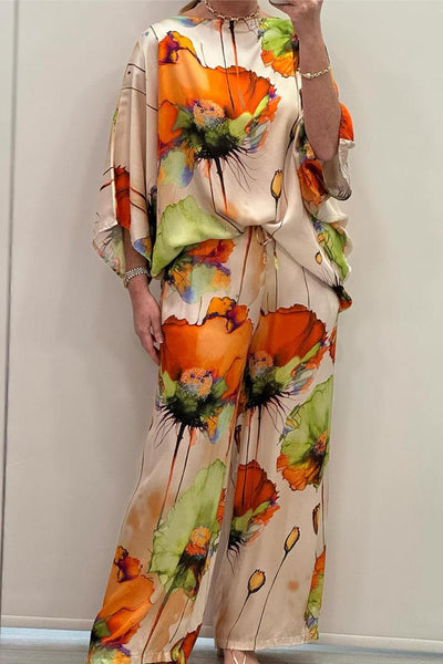 Elegante dames set met wijde blouse en bijpassende broek voor een stijlvolle uitstraling