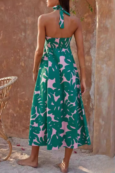 Lange boho jurk met bloemenprint en open rug ideaal voor een stijlvolle en zomerse uitstraling