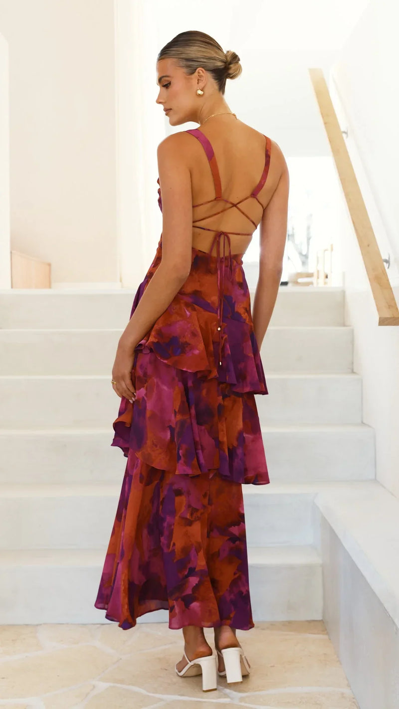 Elegante mouwloze maxi jurk met halterstijl en speelse volantdetails