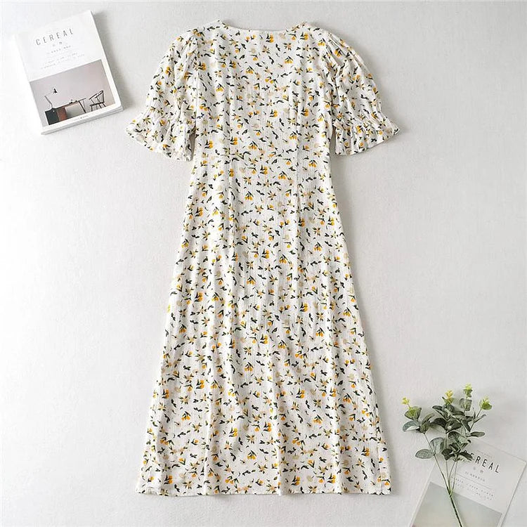 Zomerse midi jurk met V-hals en korte ballonmouwen met subtiele bloemenprint