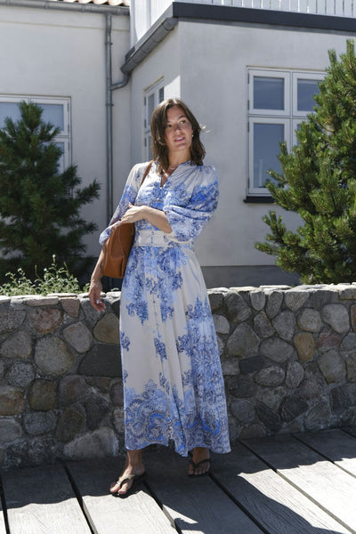 Elegante maxi jurk met knopen en driekwart mouwen