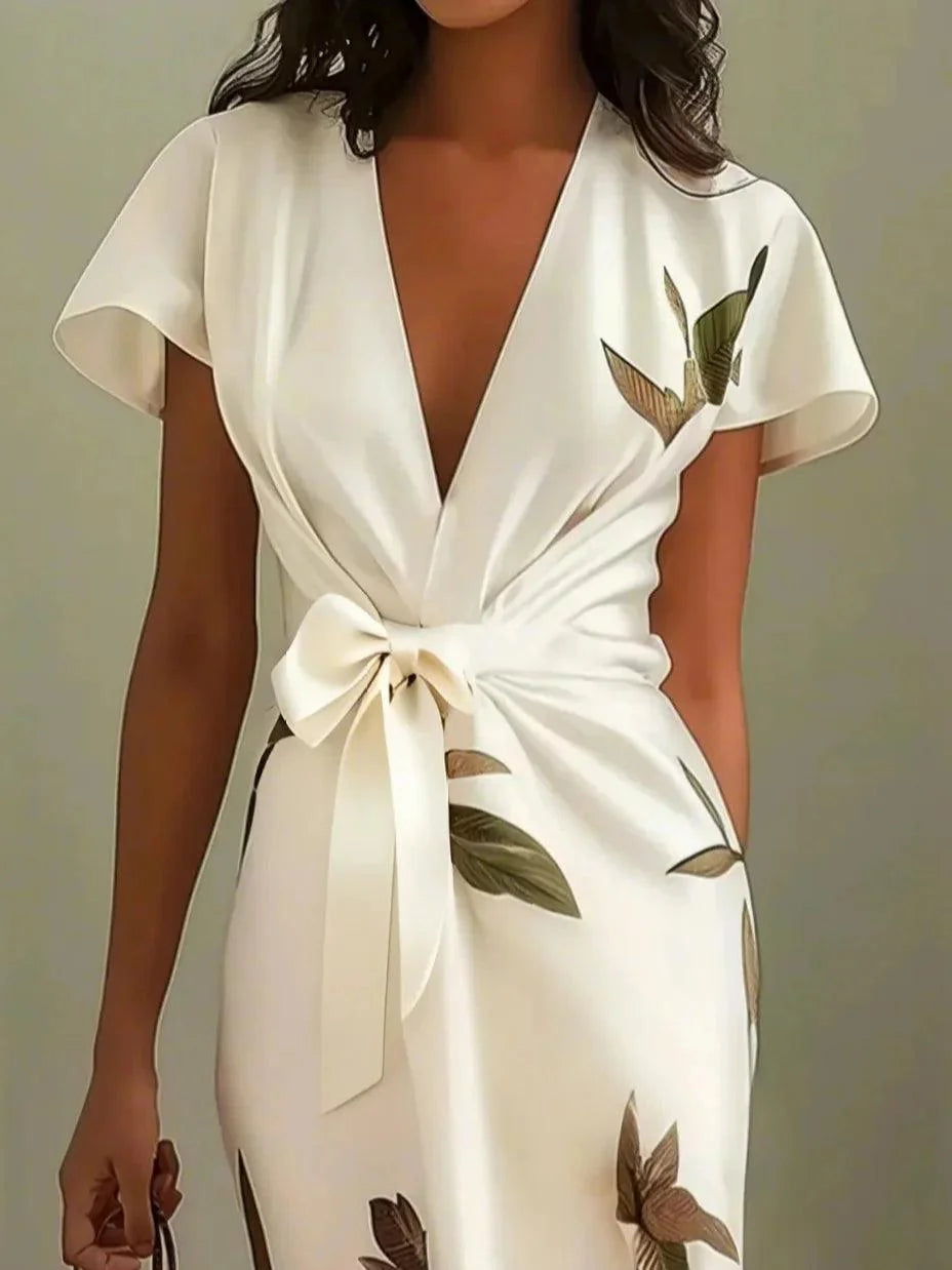 Elegante midi overslagjurk met bladprint v hals en korte mouwen
