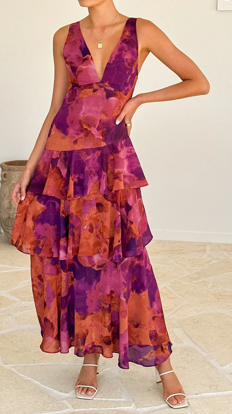 Elegante mouwloze maxi jurk met halterstijl en speelse volantdetails