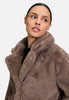 Stijlvolle korte jas in teddy stijl