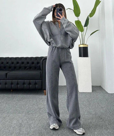 Nonchalant dames trainingspak met ritssluiting en high-waist uitlopende broek