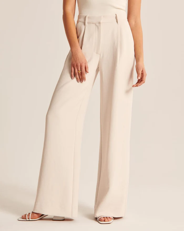 Maria - Getailleerde broek met wijde pijpen in beige
