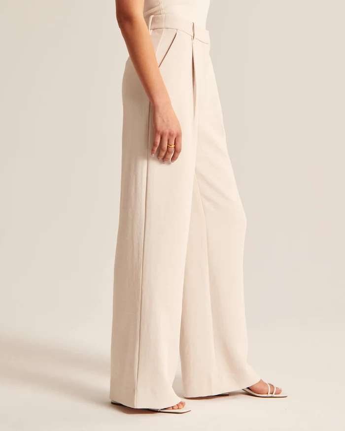 Maria - Getailleerde broek met wijde pijpen in beige