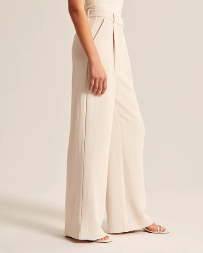 Maria - Getailleerde broek met wijde pijpen in beige