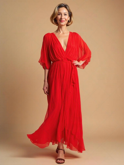 Lange elegante jurk met stijlvolle kijk en V-hals