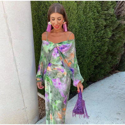 Elegante maxi jurk met smalle bandjes en open rug voor zomerse gelegenheden
