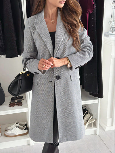 Lange elegante damesjas met knoopsluiting
