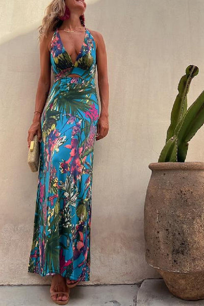 Lange crossover jurk met tropische print en open rug perfect voor zomerse gelegenheden