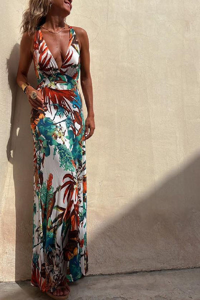 Lange crossover jurk met tropische print en open rug perfect voor zomerse gelegenheden