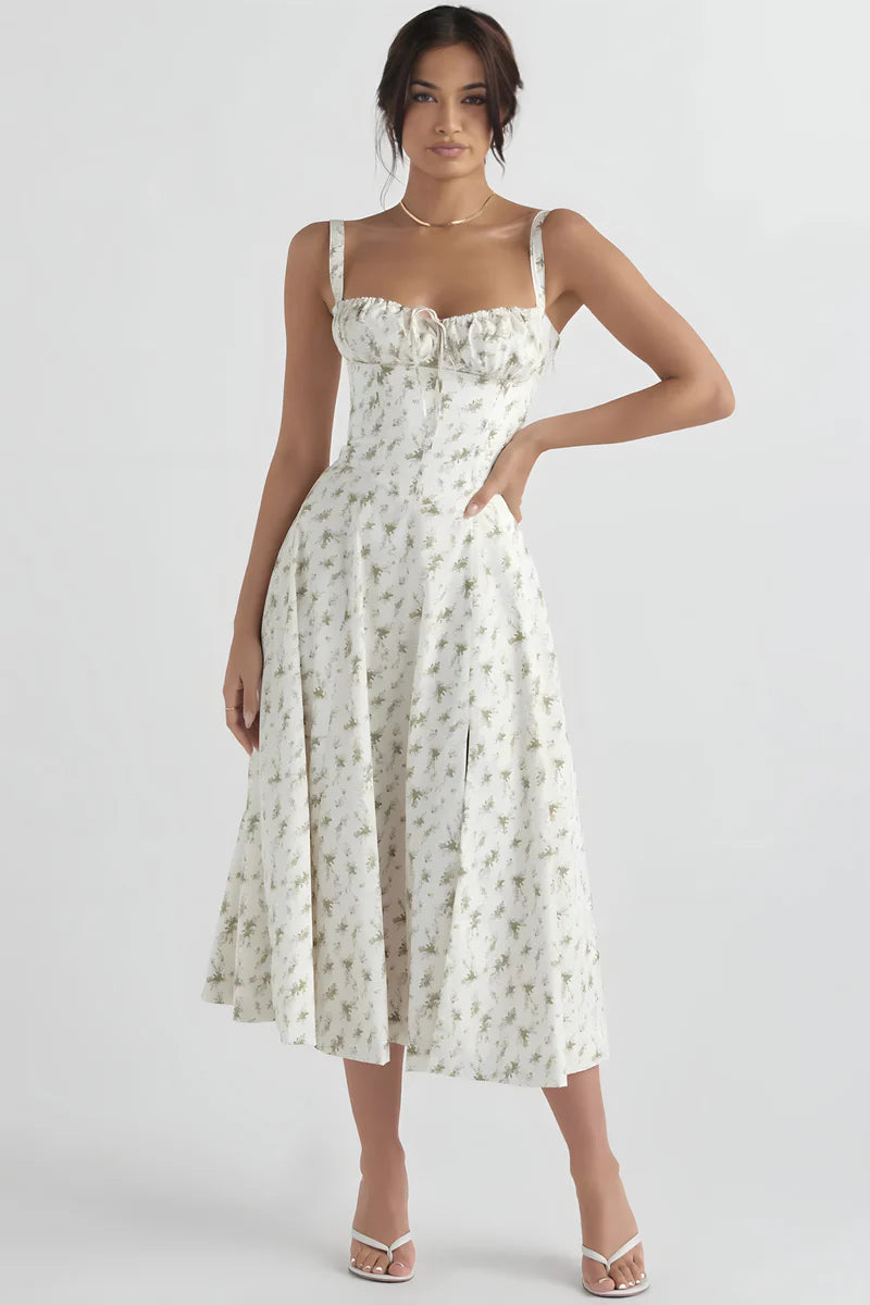 Zomerse midi jurk met bandjes en sierlijke bloemenprint