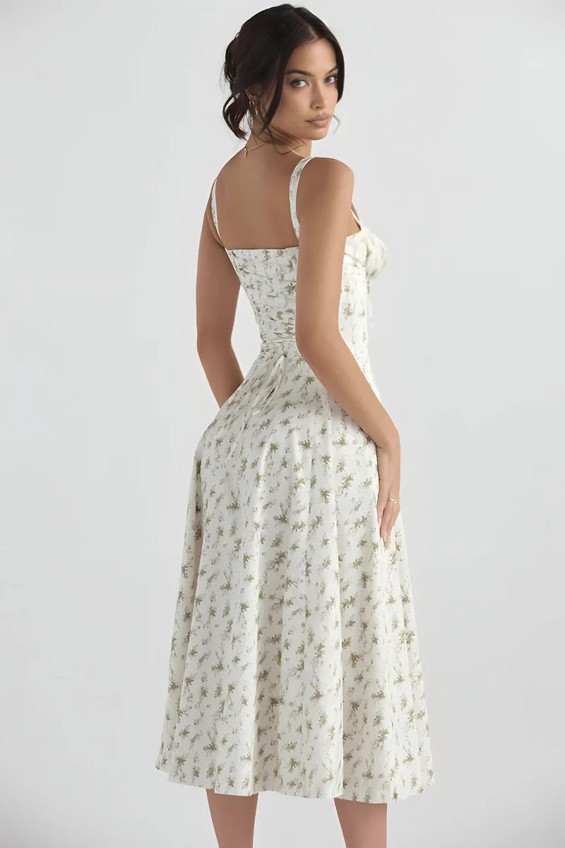 Zomerse midi jurk met bandjes en sierlijke bloemenprint