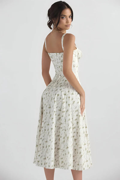 Zomerse midi jurk met bandjes en sierlijke bloemenprint
