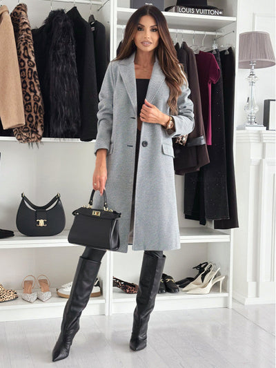 Lange elegante damesjas met knoopsluiting