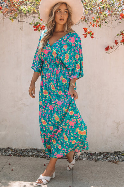 Claudia - Groene bohemian maxi jurk met diepe V-hals en bloemenprint