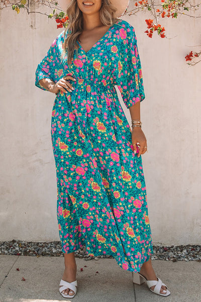Claudia - Groene bohemian maxi jurk met diepe V-hals en bloemenprint