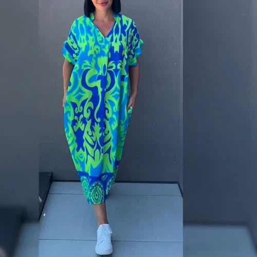 Lange elegante jurk met opvallende kleurrijke accenten