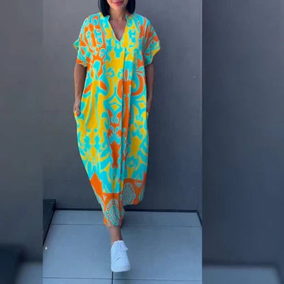 Lange elegante jurk met opvallende kleurrijke accenten