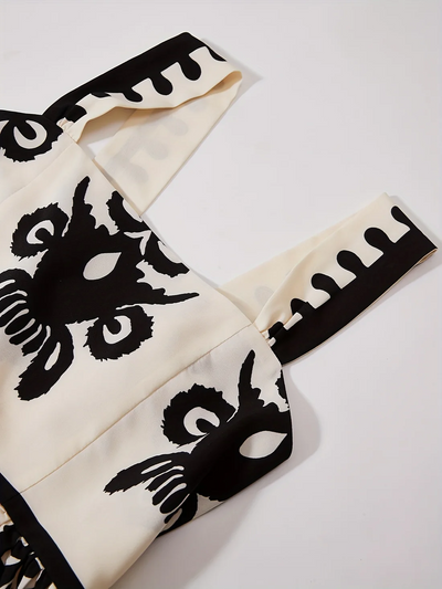 Lange mouwloze jurk met retro print en elegante uitstraling