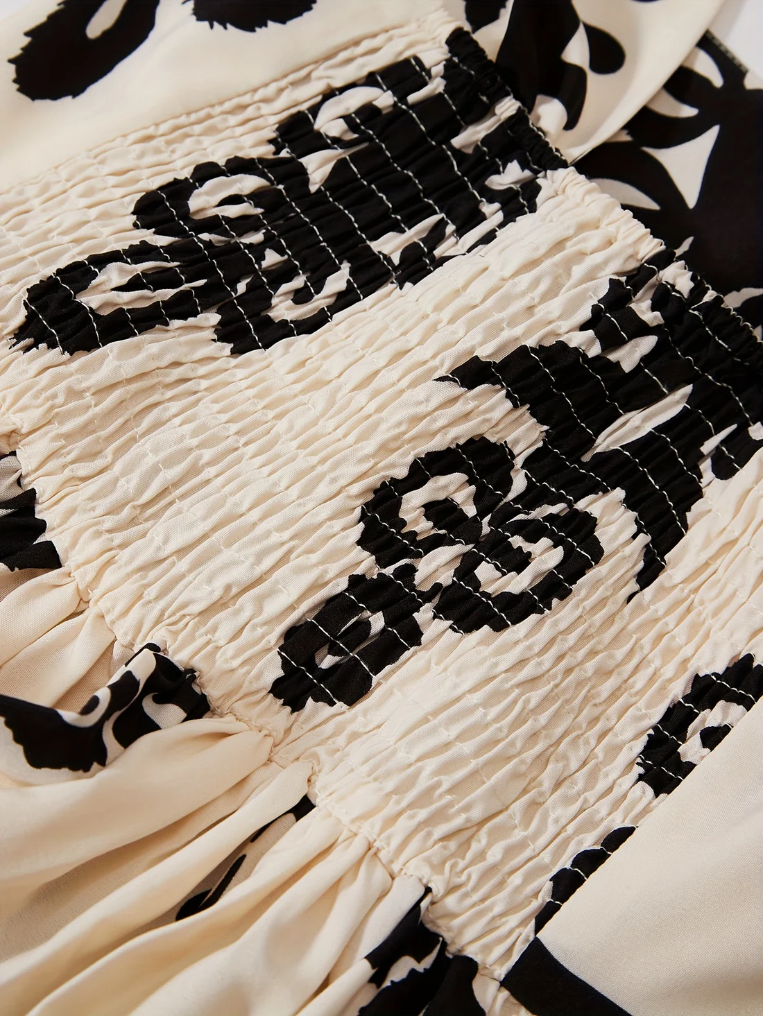 Lange mouwloze jurk met retro print en elegante uitstraling