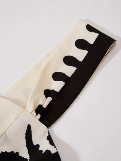 Lange mouwloze jurk met retro print en elegante uitstraling