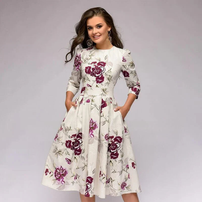 Stijlvolle midi-jurk met wijde rok en bloemenpatroon voor een elegante uitstraling