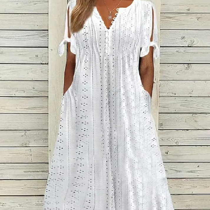Elegante jurk met V-hals en korte mouwen met open detail